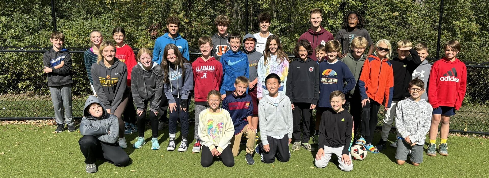 Turpin and Wilson students take a group photo at recess